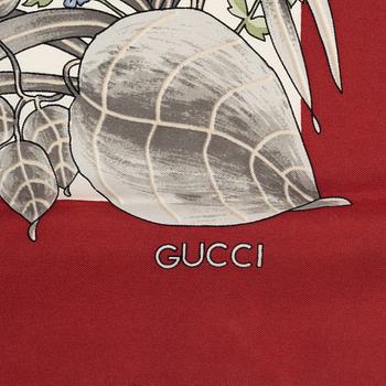 Gucci, a silk scarf.