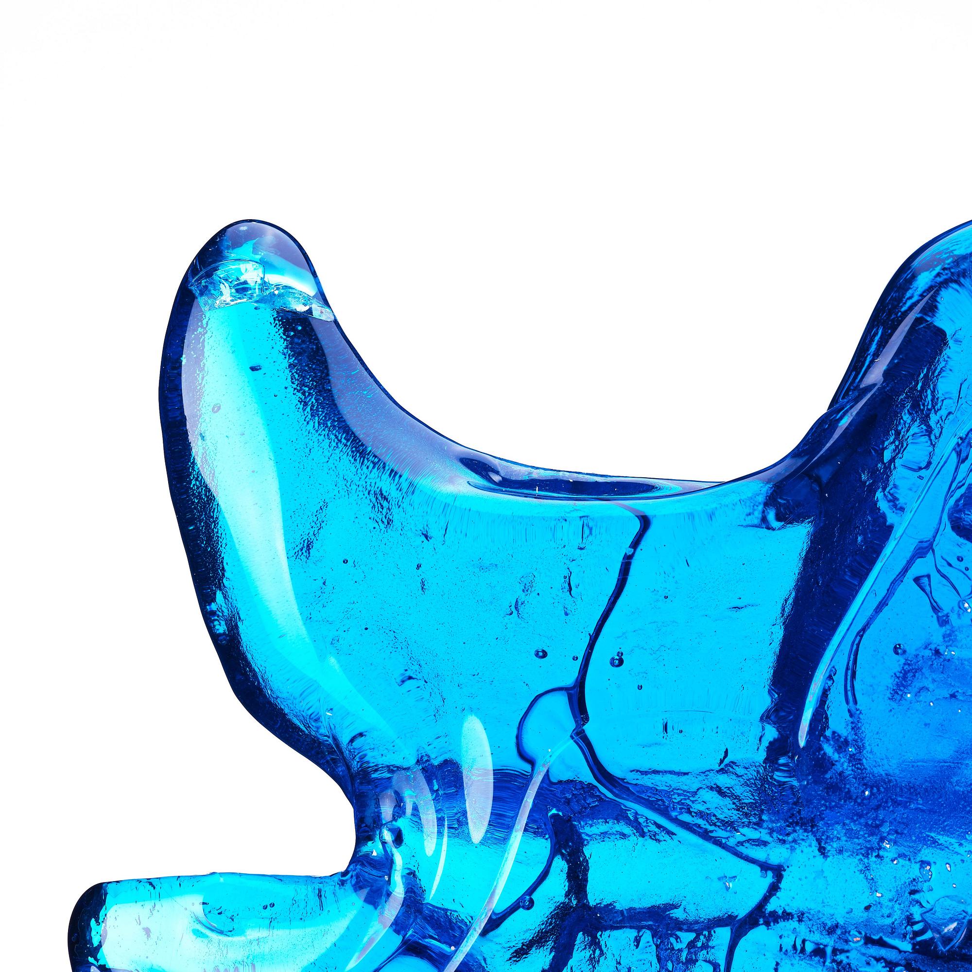 Edvin Öhrström, a blue/ turquoise coloured cast glass sculpture of a bull's head, Lindshammar glassworks, Sweden, signed and dated 1953.
