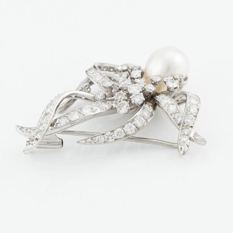 A brooch in platinum set with a pearl and round brilliant- and eight-cut diamonds designed by Henrik Bolin, W.A. Bolin.