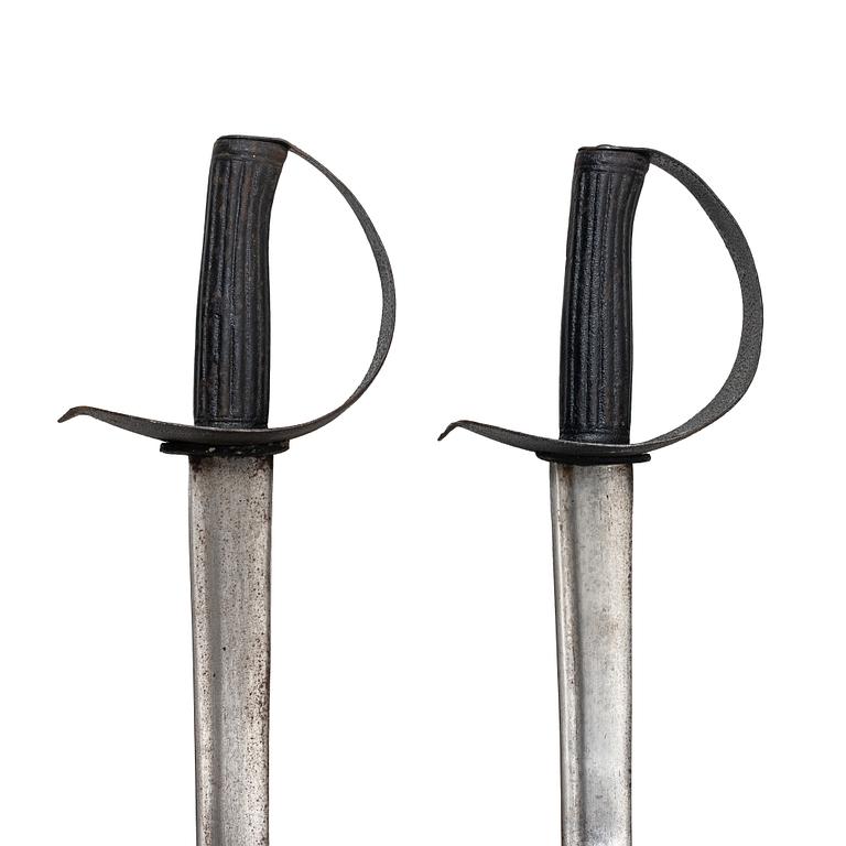 Two 19th century naval cutlasses.