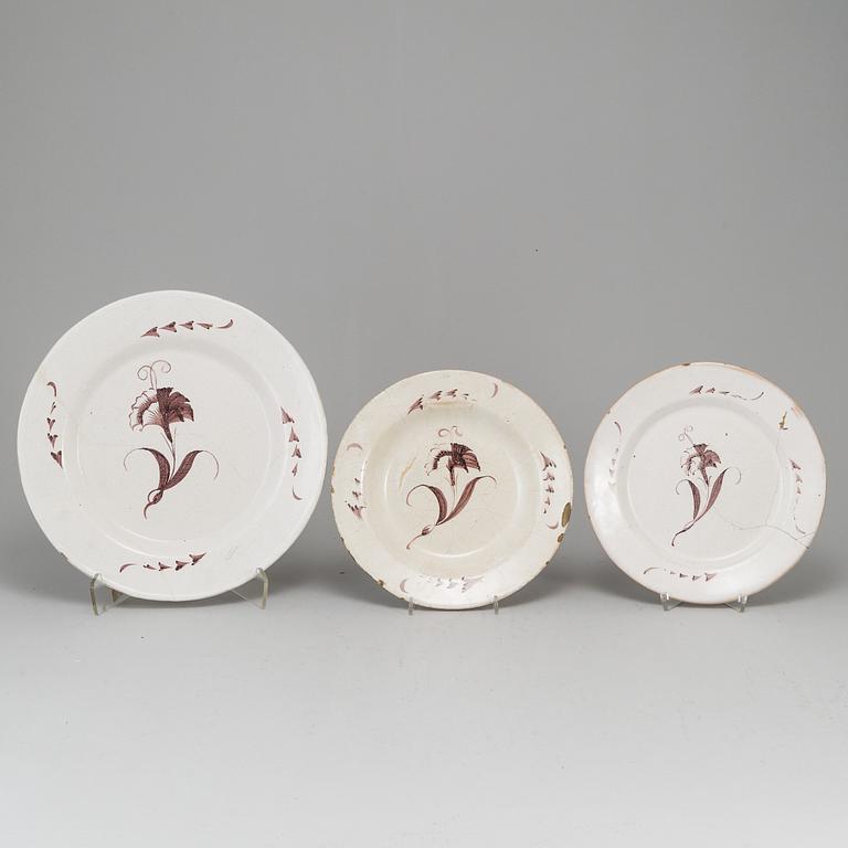 A Swedish faience serving dish and six plates, 18th Century.