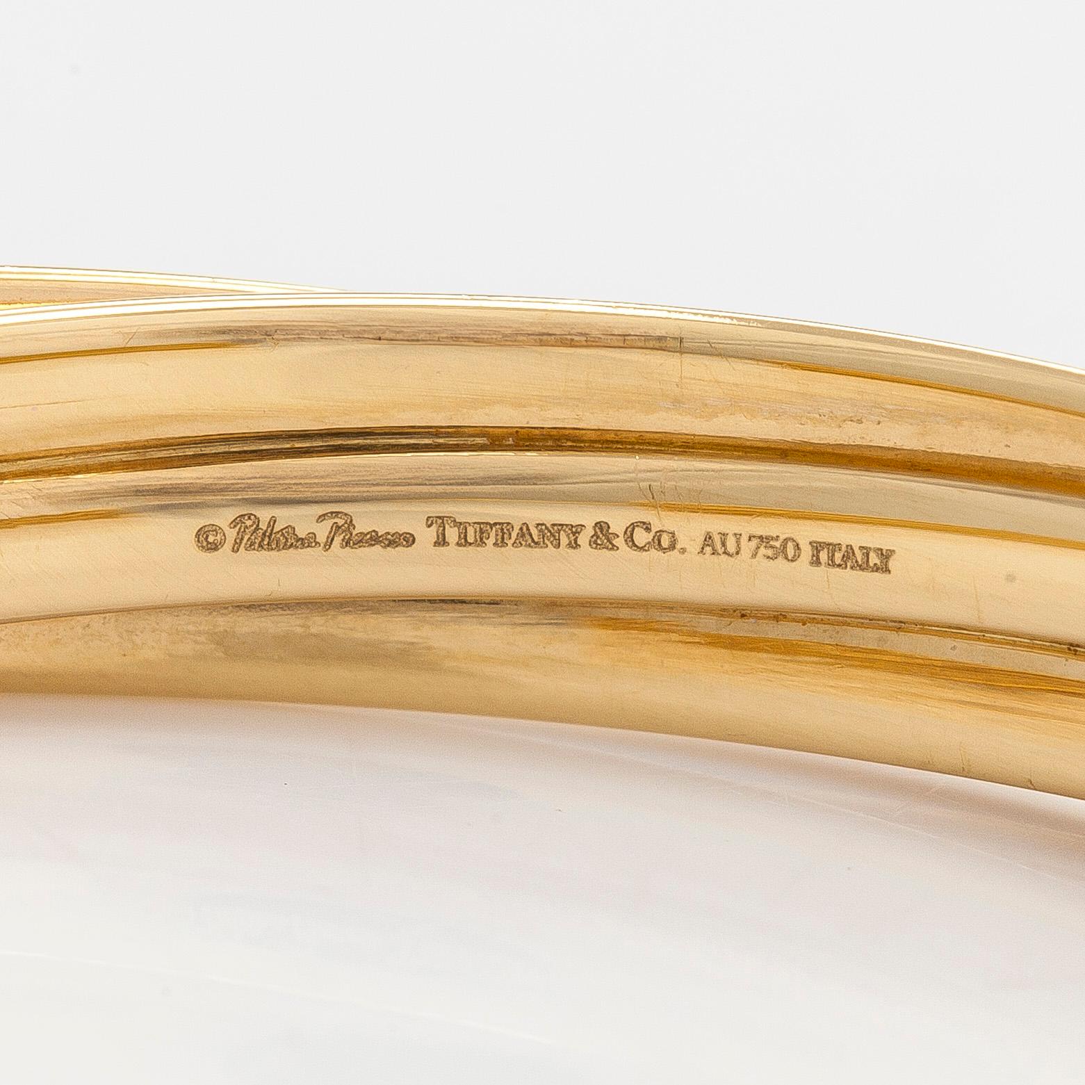 Tiffany & Co, Paloma Picasso, "Melody" hoop earrings in 18K gold.