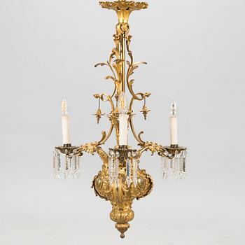 A brass chandelier with prisms, second half of the 19th century. Height 83 cm.