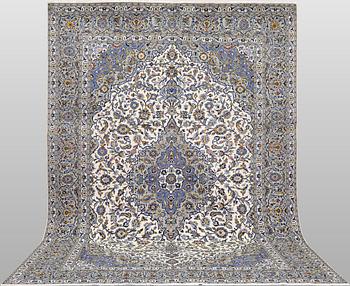 A Keshan carpet, signed, 386 x 281 cm.