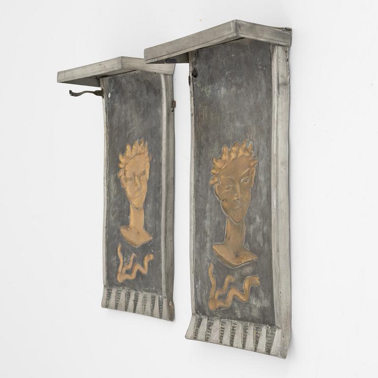 David Wretling, a pair of 1920's/30's Swedish Grace pewter wall sconces, signed.