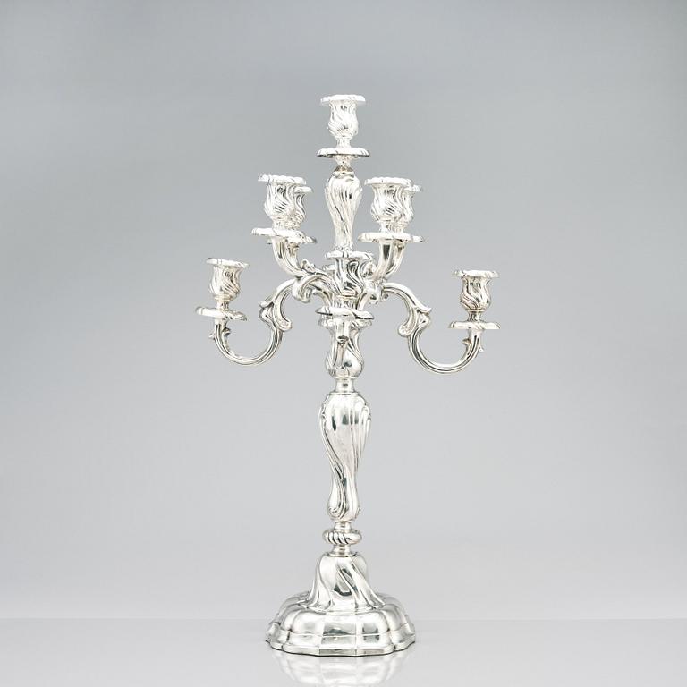 A pair of eight-light Louis XV-style silver candelabra, mark of Hermann Julius Wilm, Berlin, circa 1900.