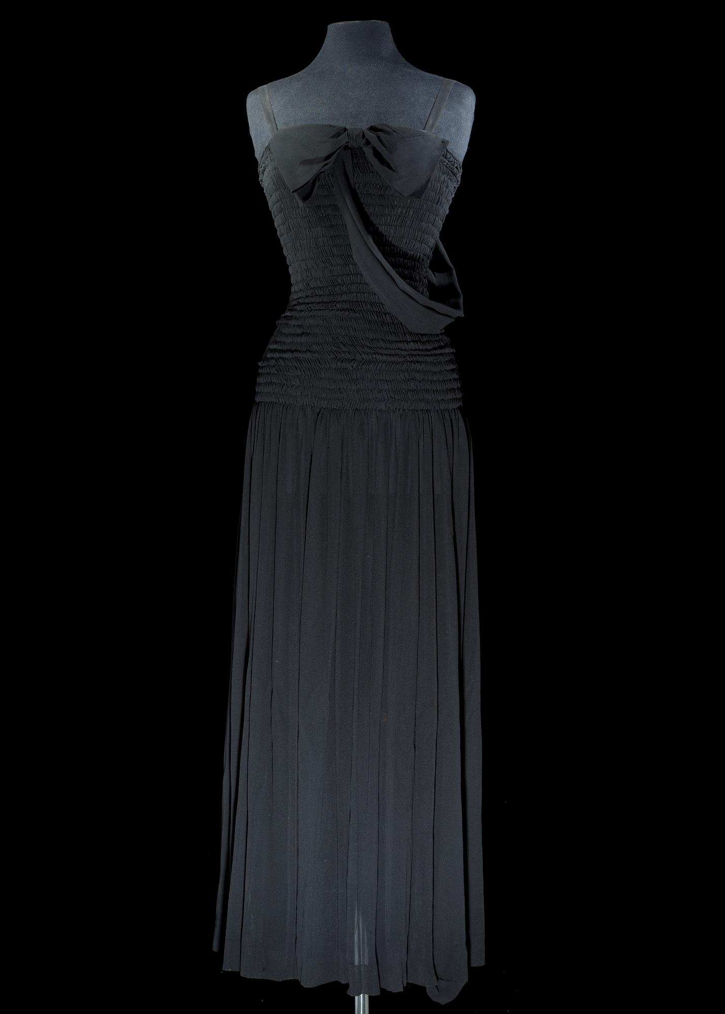 A black silk long dress by Yves Saint Laurent.