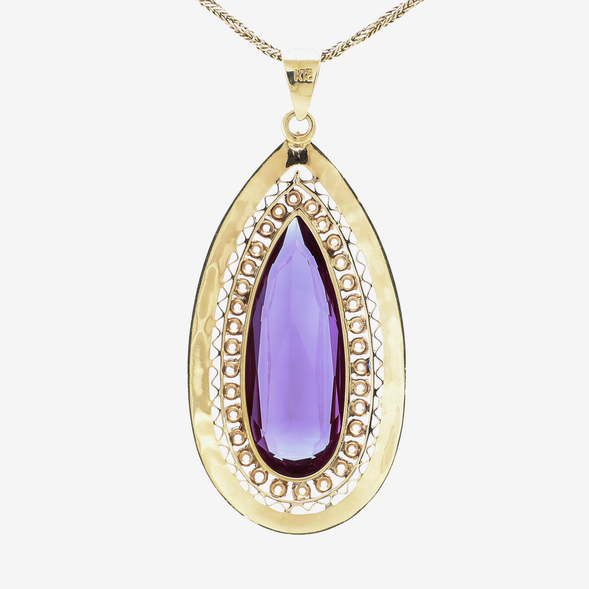 Necklace 18K and 14K gold with faceted synthetic purple sapphire.