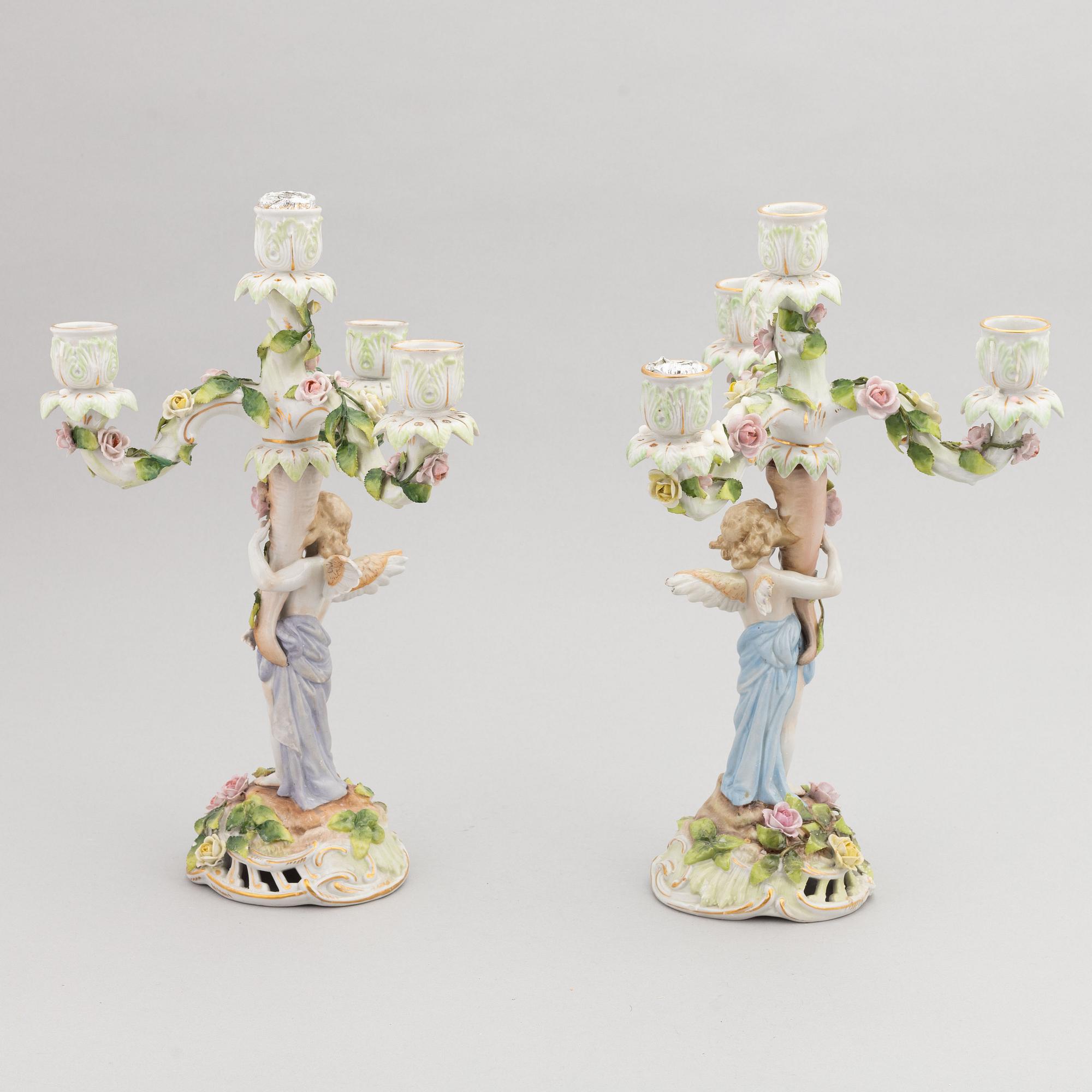 A pair of porcelain rococo style candelabra and a centerpiece bowl, Plaue, Germany, first half of the 20th century.