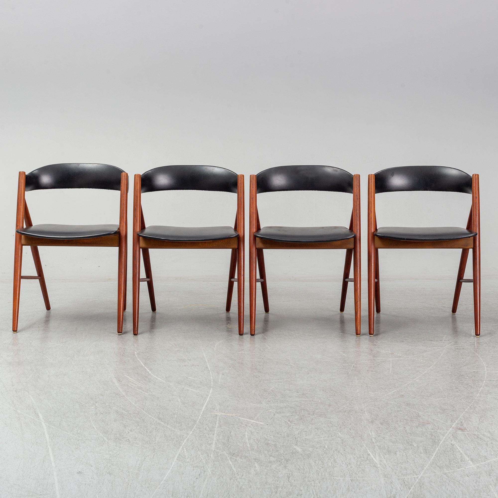 Four 1960s teak chairs.