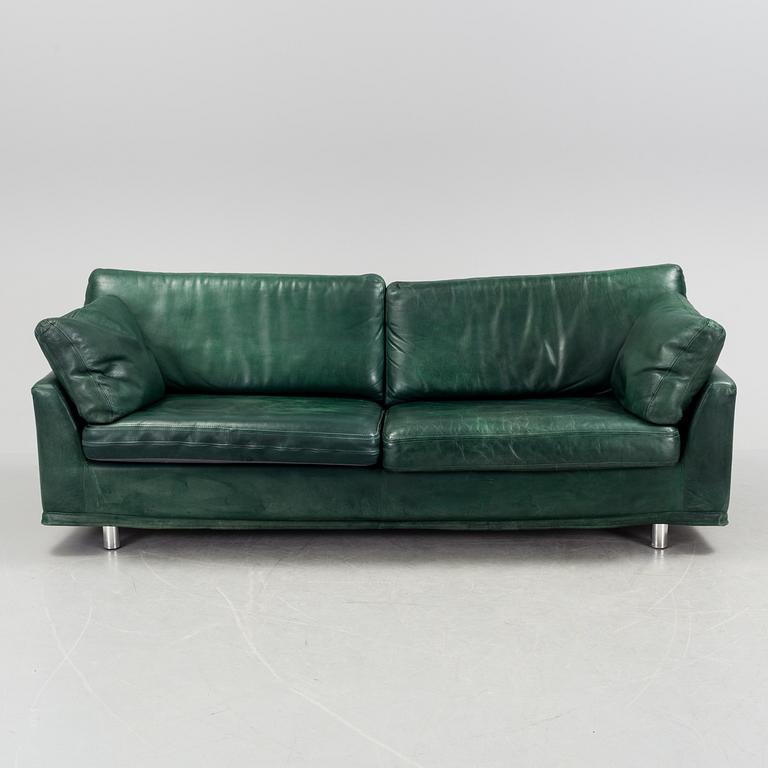 A "Fredrik" green leather sofa by Dux.