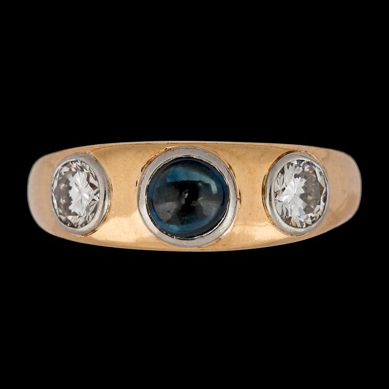 A cabochon cut blue sapphire and brilliant cut diamond ring, tot. app. 1 cts.