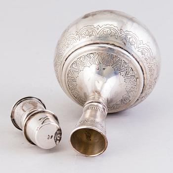 A Russian silver carafe with six cups, assay master's mark Anatoly Apollonovich Artsibashev / A. Romanov, Moscow 1889.