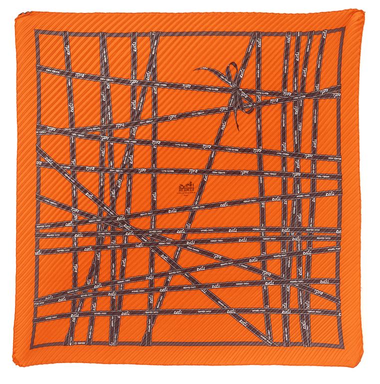 A silk scarf by Hermès.