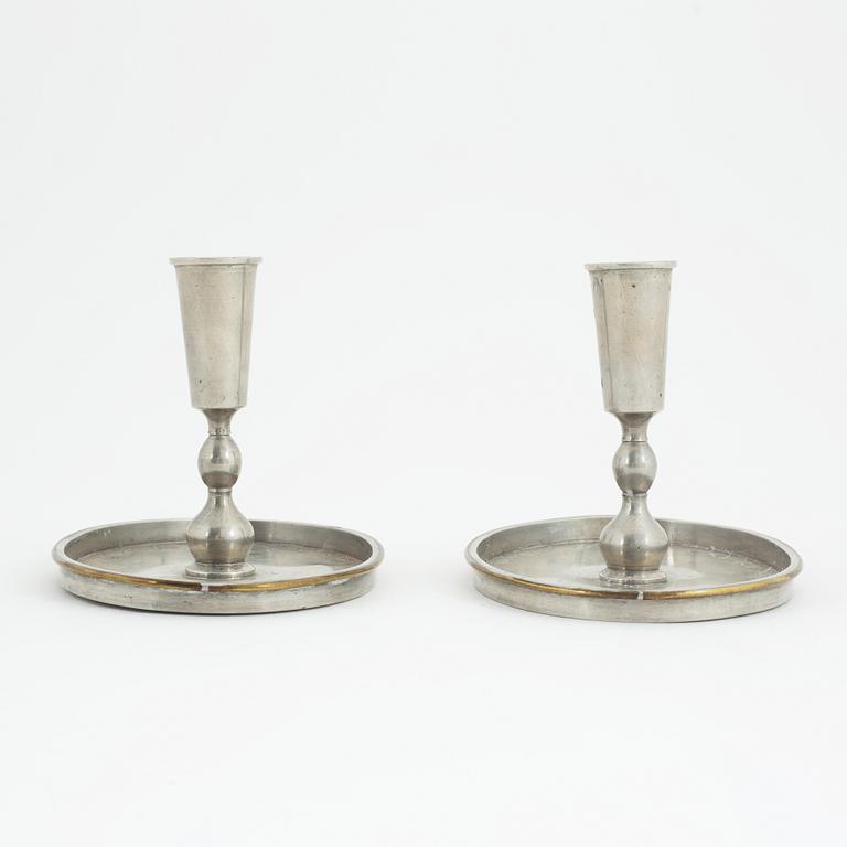 Nils Fougstedt, probably, a pair of pewter and brass candlesticks, model '93', for Firma Svenskt Tenn, Stockholm 1926.