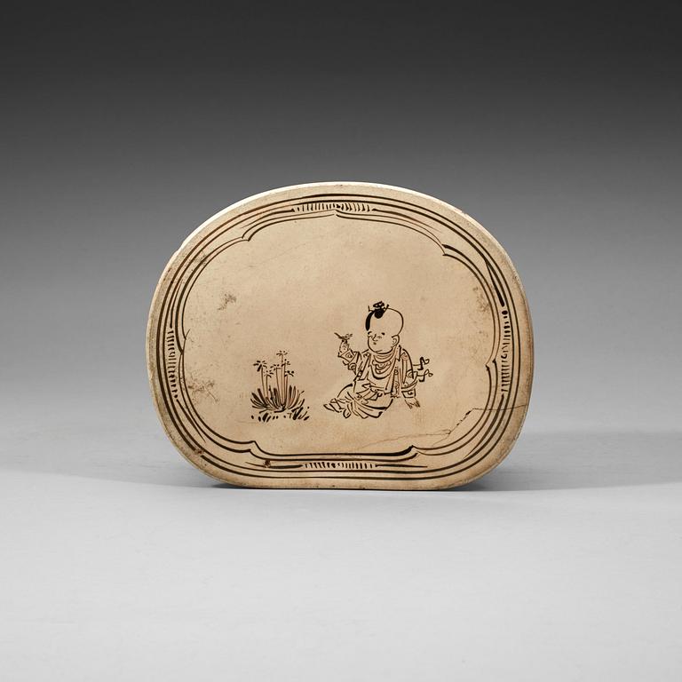 A Citzhou cream-glazed pillow, presumably Northern Song dynasty 10th/11th Century.