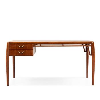 A Carl-Axel Acking Swedish Modern mahogany desk, Nordiska Kompaniet, 1950's.