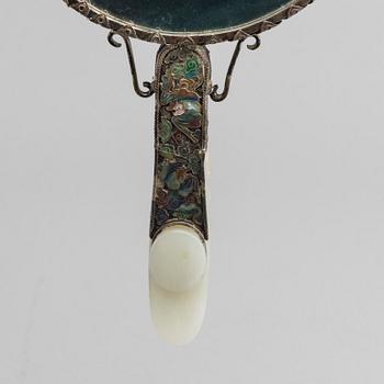 A Chinese silver mirror with carved nephrite placque and belt hook, early 20th Century.