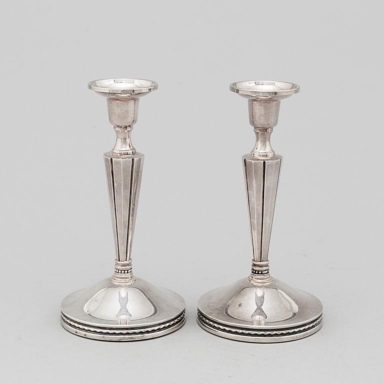 A pair of silver candle sticks by Eric Löfman, Uppsala 1976.