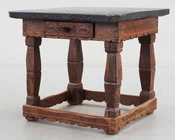 A Swedish stone top table dated 1826.