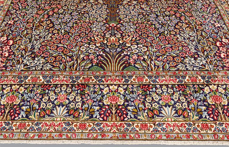 A Kirman Laver carpet, 'Millefleur', approx. 400 x 295 cm.