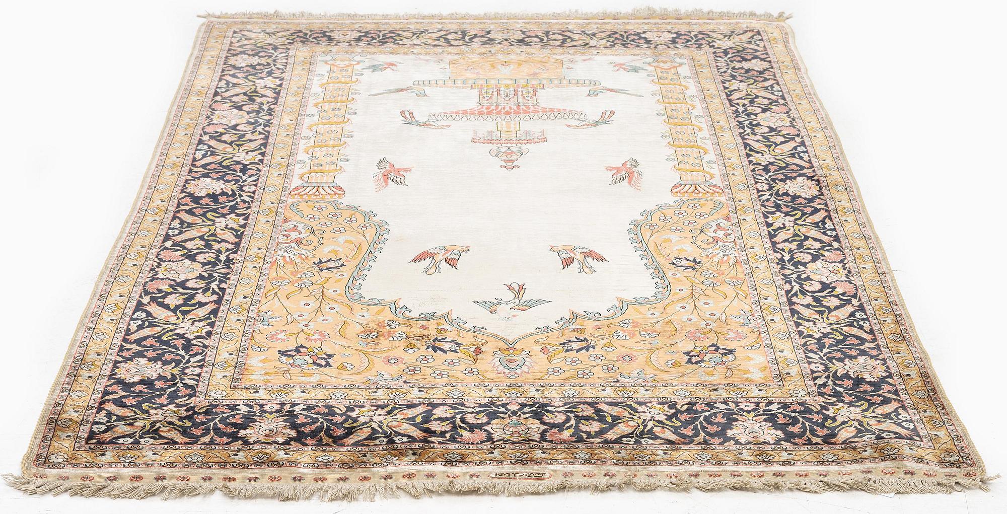 A semi-antique/old pictoral silk Hereke rug, West Anatolia, c. 152 x 103 cm.