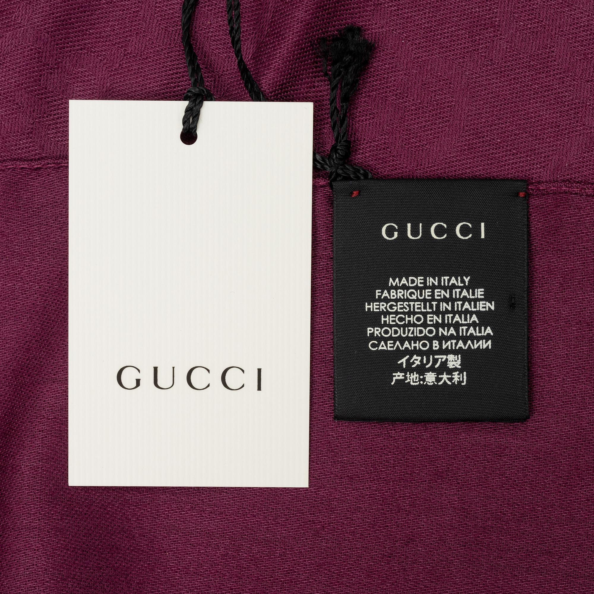 Gucci, a wool and silk mix "GG" jaquard shawl.