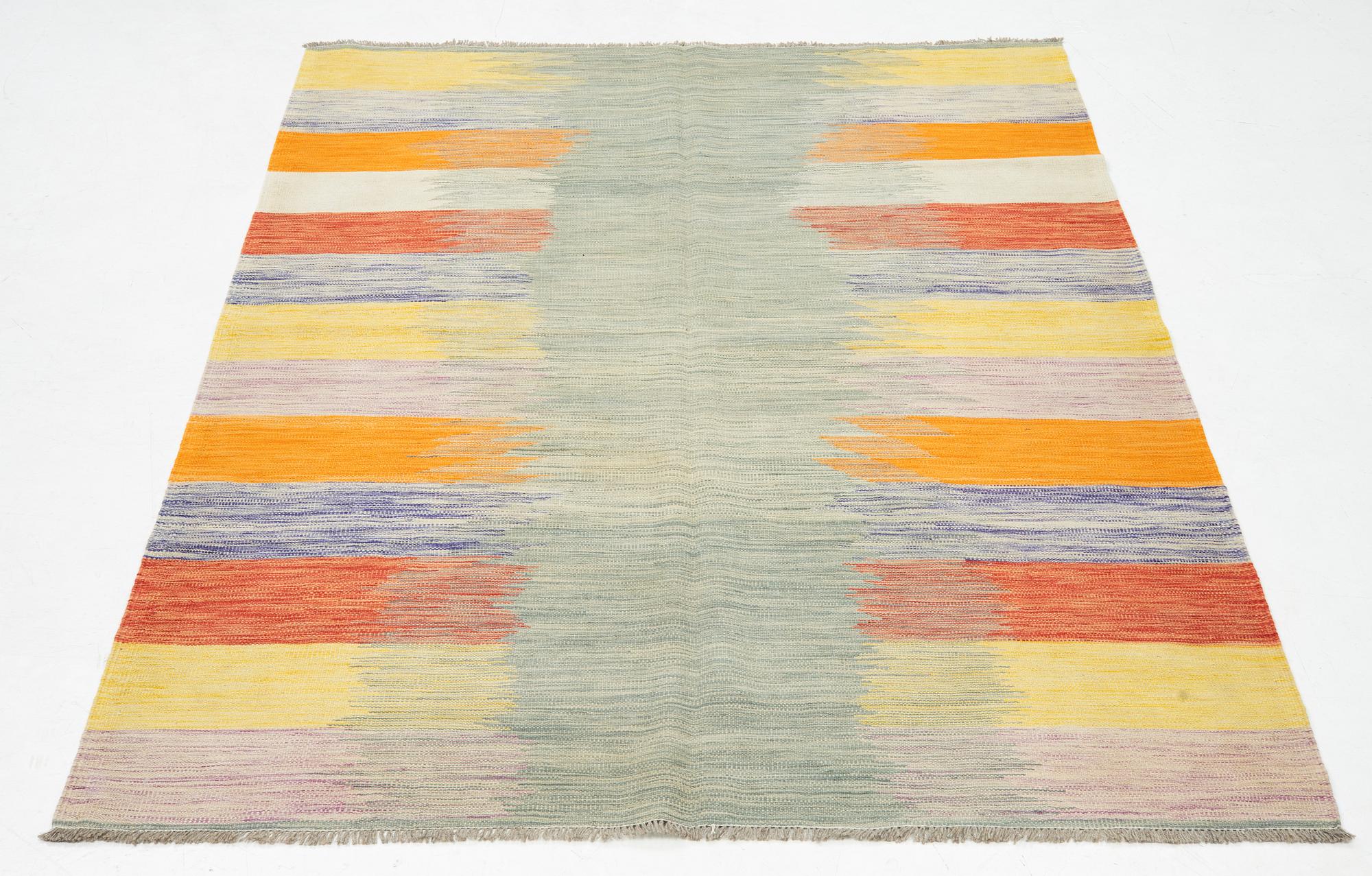 A kilim rug, ca 252 x 175 cm.