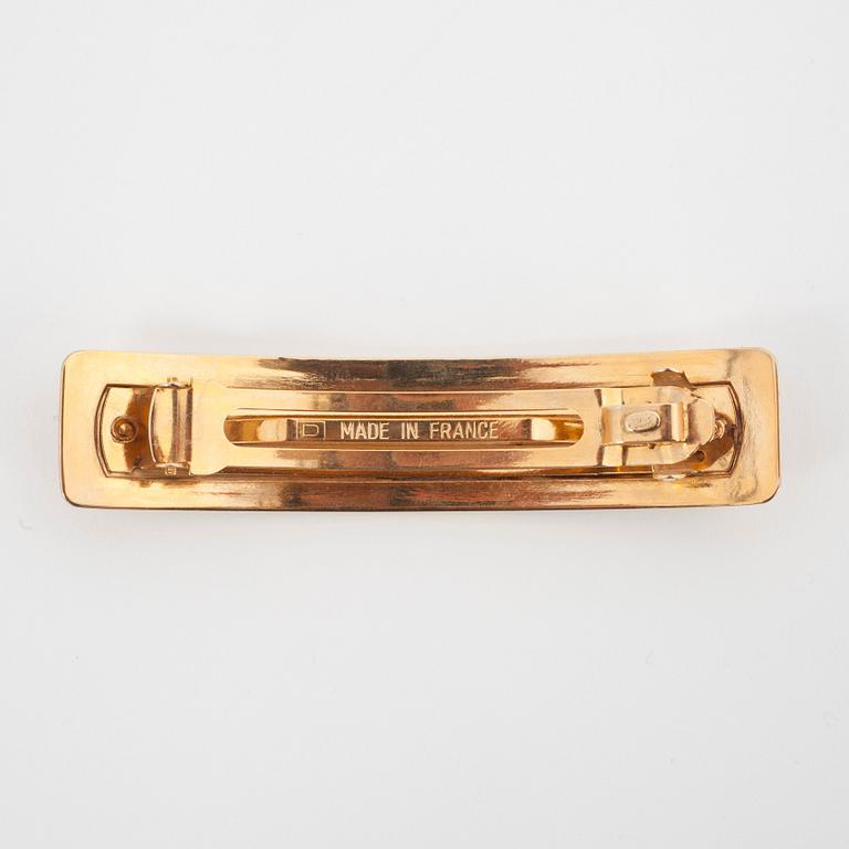 CHANEL, a gold colored metall hair clip.