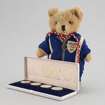 Olympic memorabilia: A teddy bear and four silvercoins from the 1972 games in Munich.