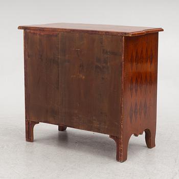A Baroque style chest of drawers, circa 1900.