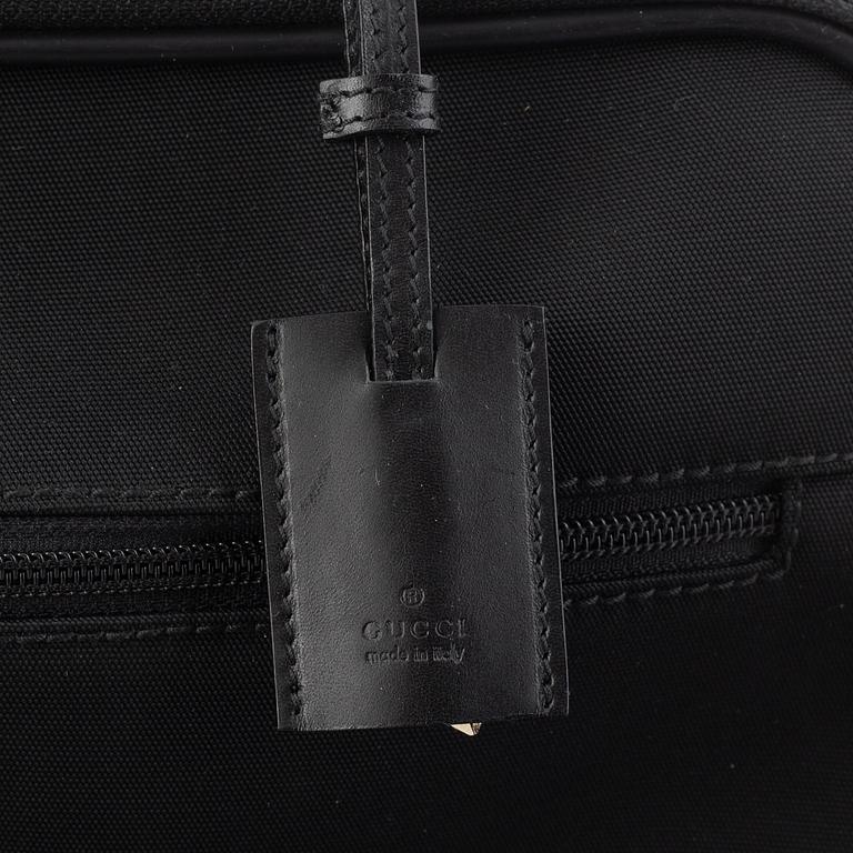 Gucci, suitcase/cabin bag.