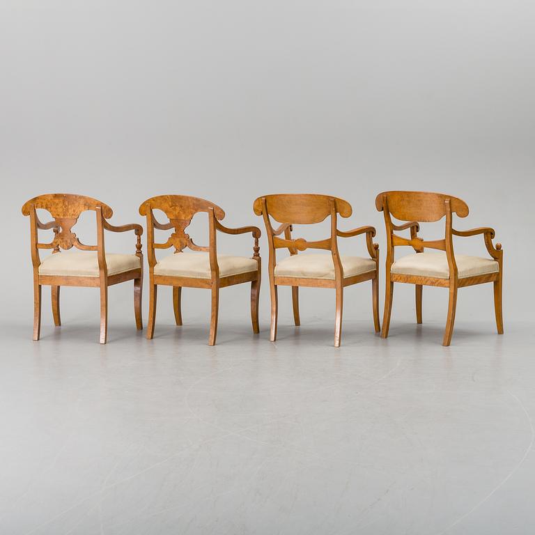 A set of four mid 19th century arm chairs.