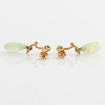 Earrings with pear-shaped prehnite, peridot, and brilliant-cut diamonds.