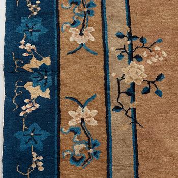 A CARPET, a semi-antique Beijing, China, 295,5 x 247,5 cm.