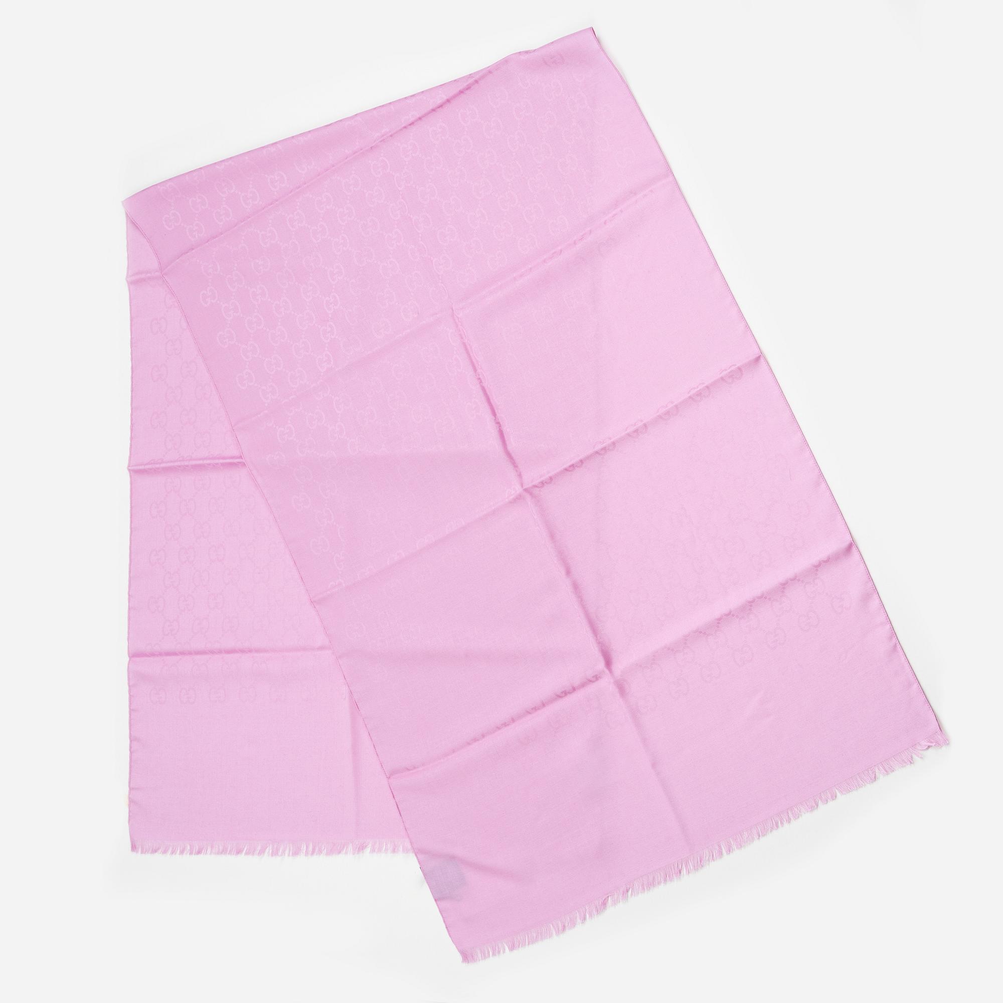 Gucci, a wool and silk mix "GG" jaquard shawl.