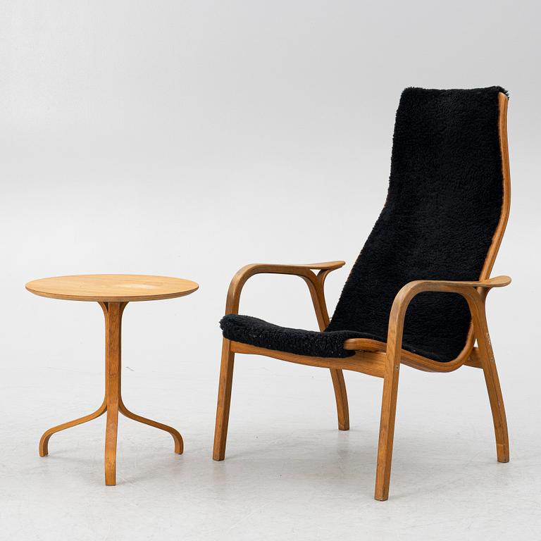 Yngve Ekström, a 'Lamino' armchair and sidetable, Swedese, Sweden, early 21st century.