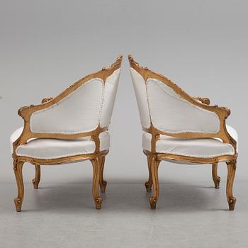 A pair of 20th century easy chairs.