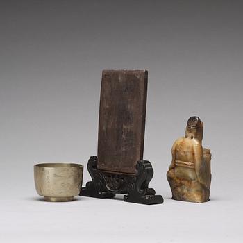 A stone placque, a soapstone figure and a cup, late Qing dynasty.