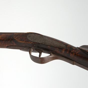 A mid 19th century percussion rifle.