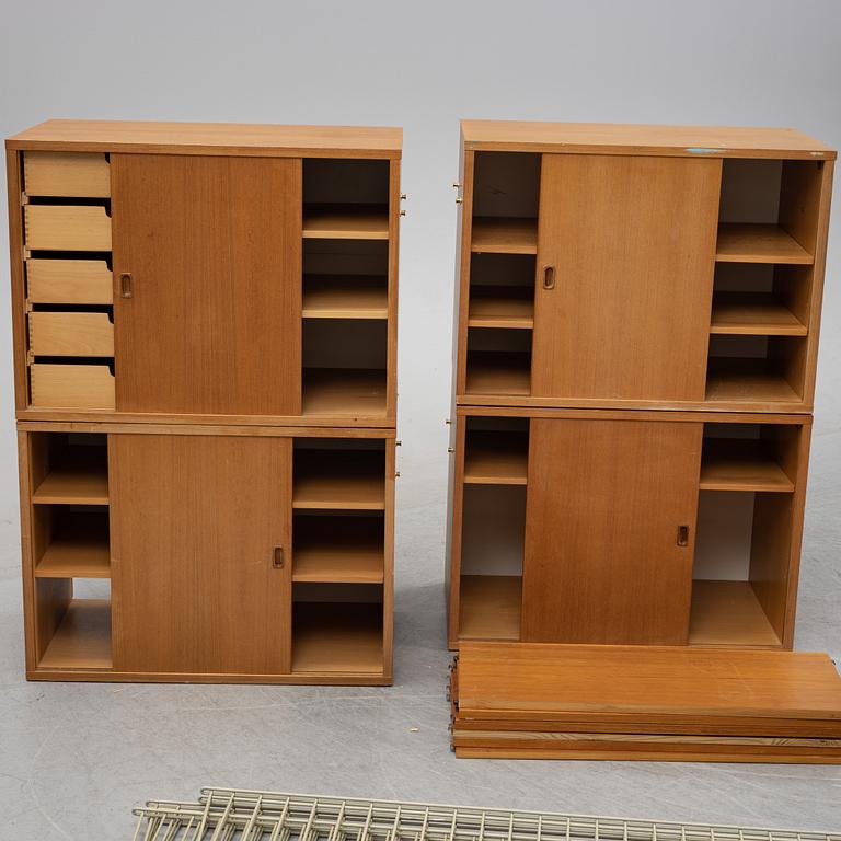 A 'String' teak veneered shelving system by Nils Strinning.