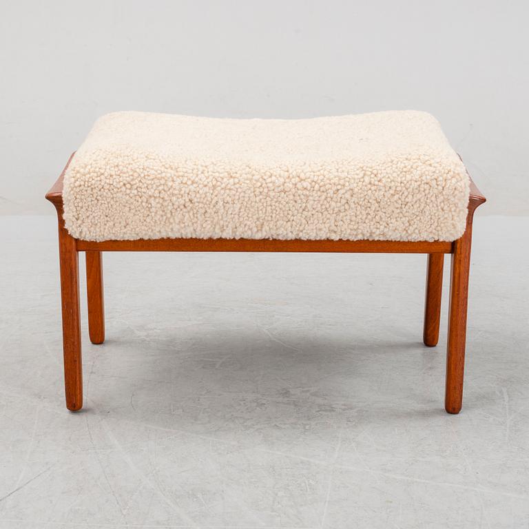 A Danish mid 20th Century sheepskin upholstered ottoman.