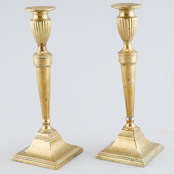 A pair of brass candlesticks, 19th century.