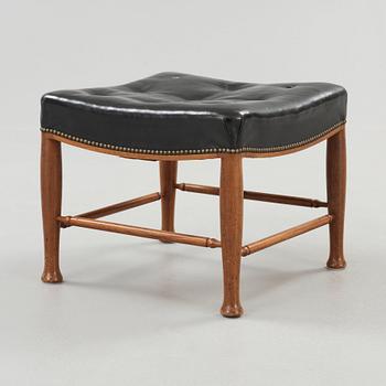 A Josef Frank mahogany and black leather stool, Svenskt Tenn, model 902.