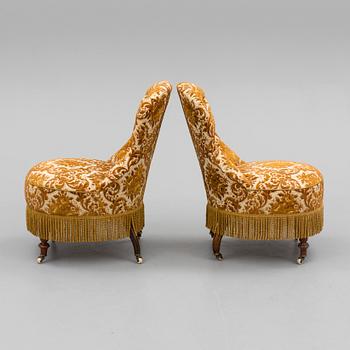 A pair of easy chairs, circa 1900.