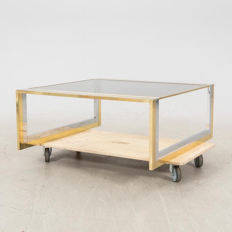 A glass and metal coffee table from Romeo Rega second half of the 20th century.