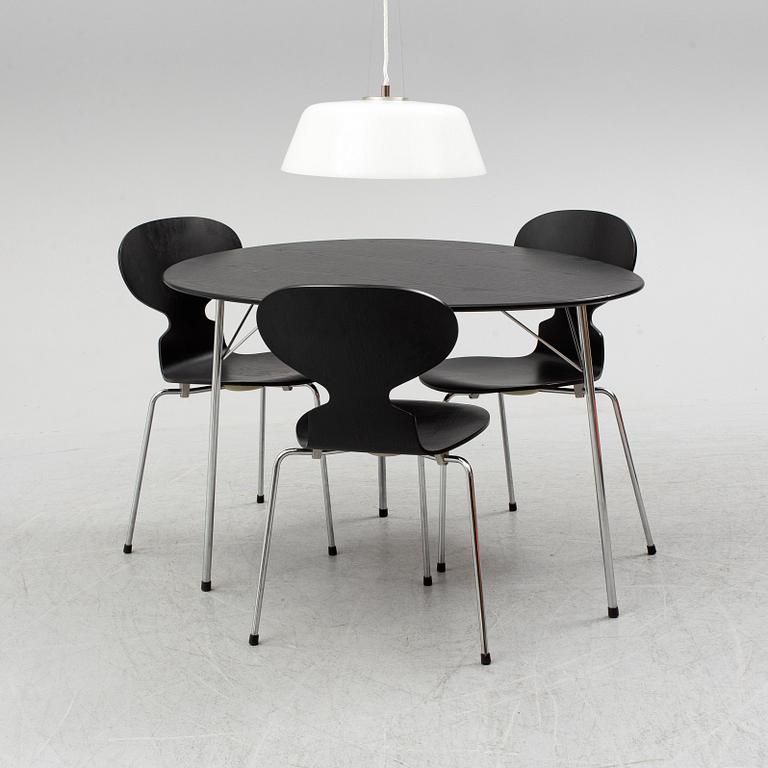 An Arne Jacobsen "Centenary Package" comprising three "Ant Chairs" and an eggshaped table, Fritz Hansen, Denmark.