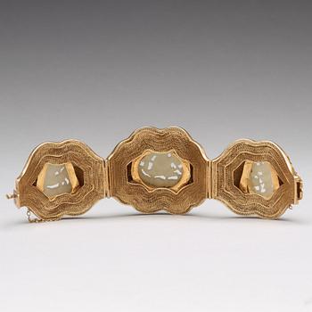 A filigree bracelet with inlays of cloisonné and carved nephrite, Qing dynasty.