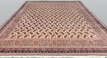 A Kirman carpet, signed, c. 390 x 295 cm.