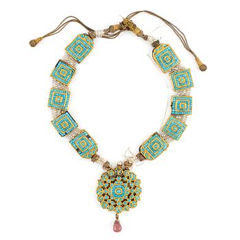 594. An antique gold and enamel Qajar necklace with pearls set with turquoises and with a garnet drop.
